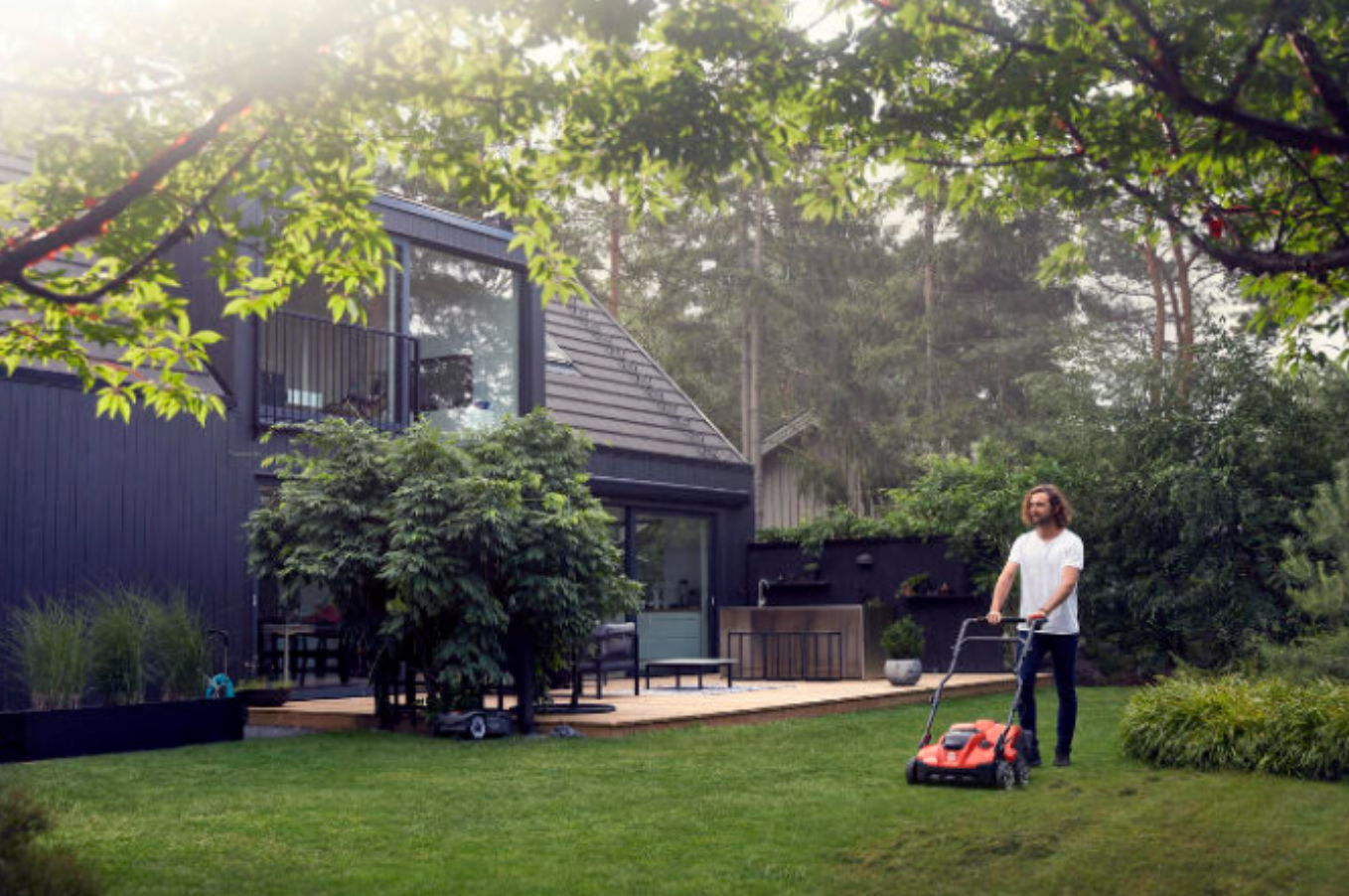 man dethatching lawn battery scarifier